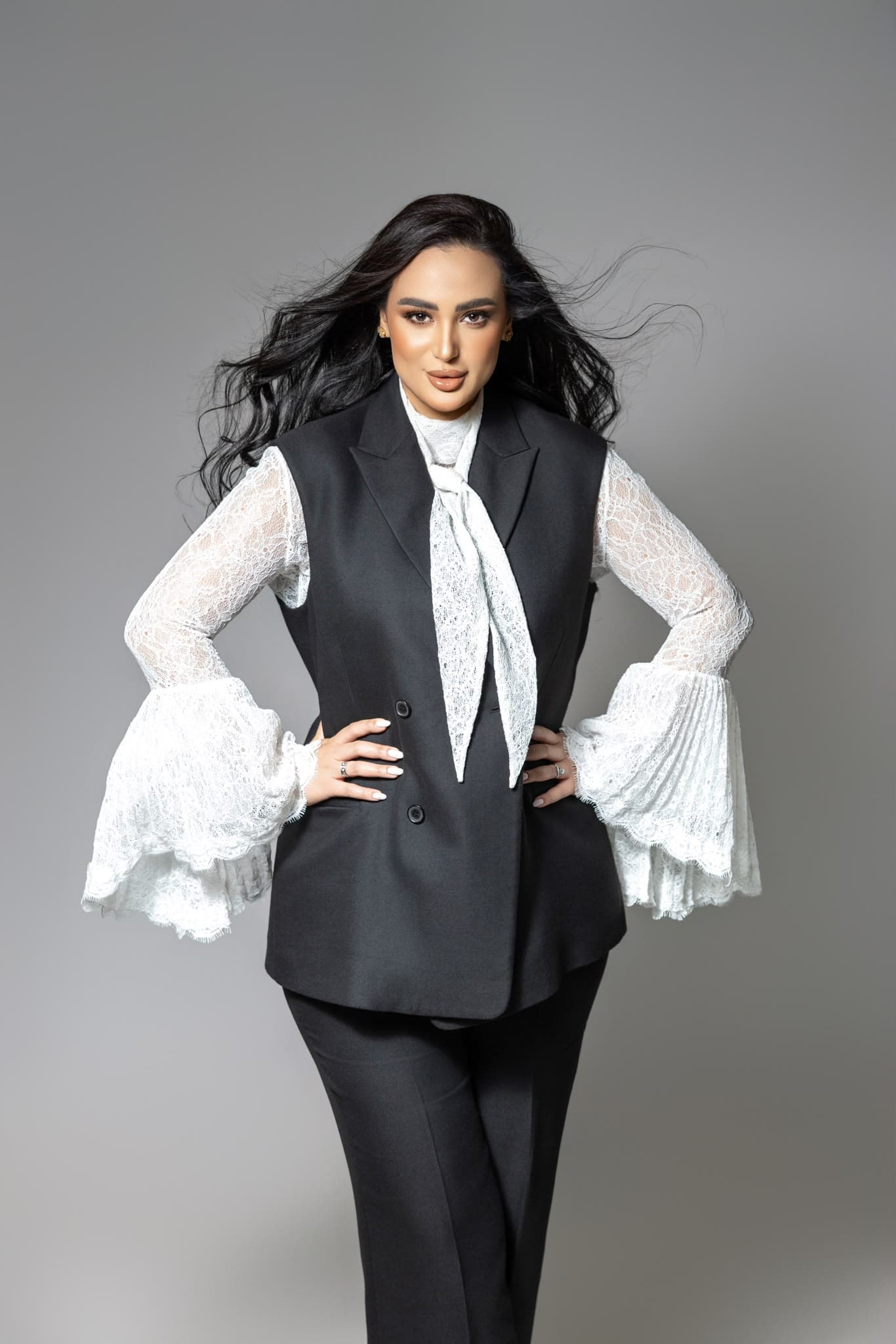Ghada Arbi in a black suit