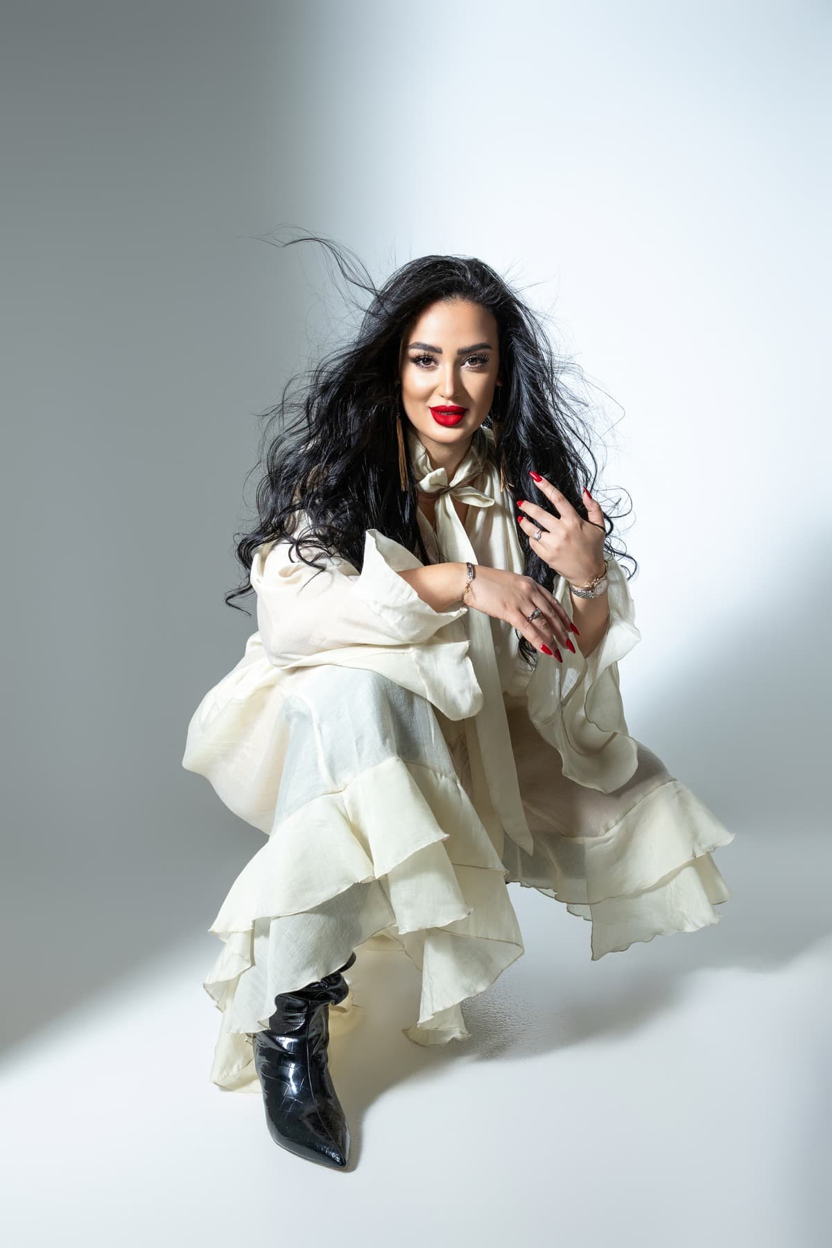Ghada in her cream outfit studio portrait